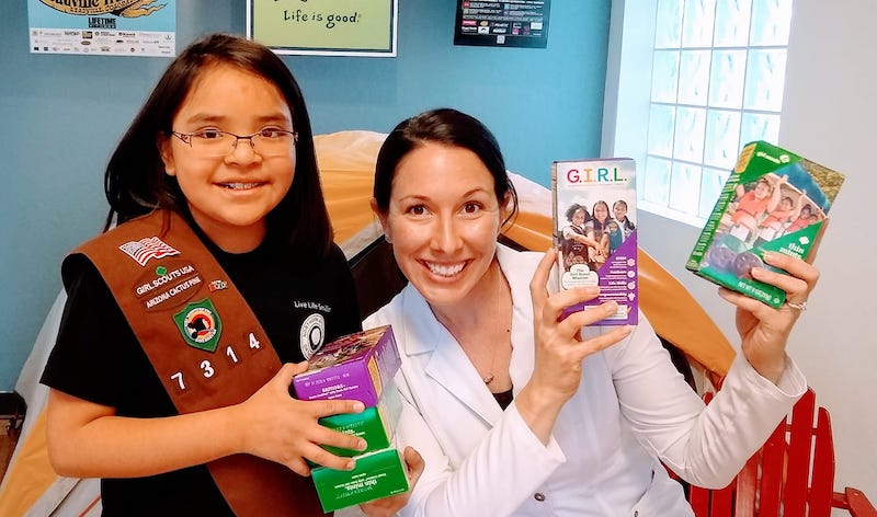 Dr. w/ Girl Scout/patient in braces